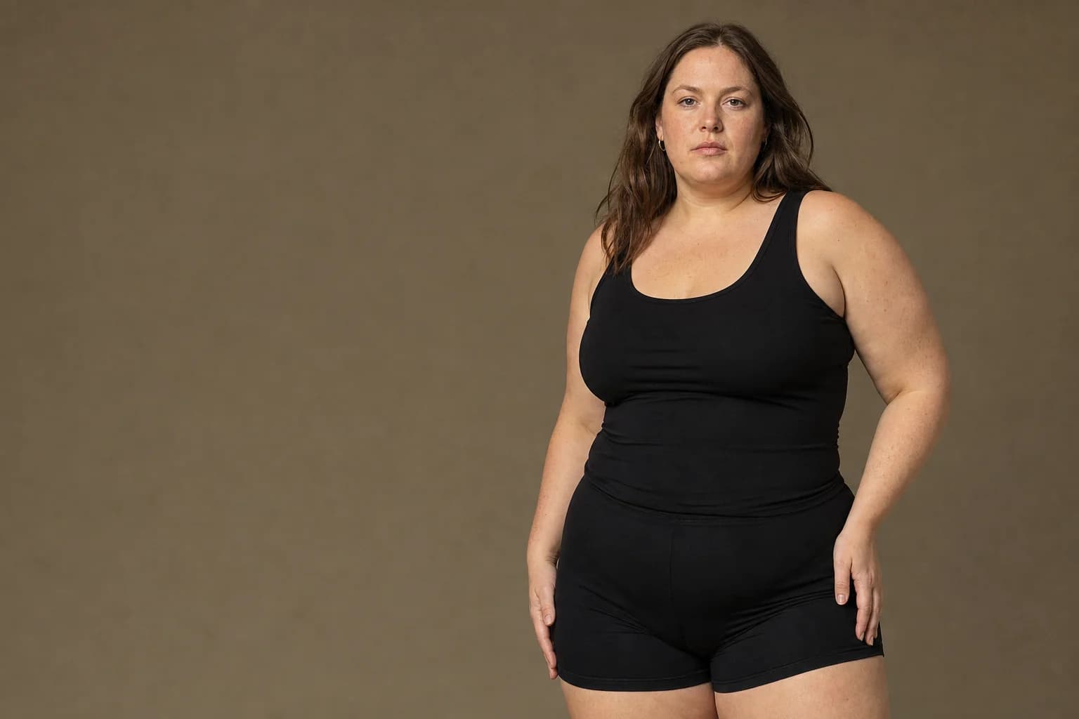 Plus size model wearing a WoWearShape shaping bodysuit